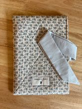 Load image into Gallery viewer, Cottage Blue Floral Quilted Bow Book Sleeve
